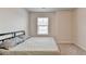 Bright bedroom features soft carpeting, a twin bed, and a window with natural light at 94 Depot Landing Rd, Auburn, GA 30011