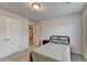 Bedroom features soft carpeting, a twin bed, a nightstand, and closet access at 94 Depot Landing Rd, Auburn, GA 30011