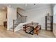 Charming dining area with wood table, bench seating, and natural light, adjacent to staircase at 94 Depot Landing Rd, Auburn, GA 30011
