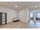 Bright flex room boasts a comfortable loveseat, accent pillows, and modern shelving at 94 Depot Landing Rd, Auburn, GA 30011