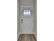 Classic white front door with glass pane and modern hardware set against a neutral wall at 94 Depot Landing Rd, Auburn, GA 30011