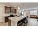 Beautiful kitchen showcasing a granite island, stainless steel appliances, and wood-style flooring at 94 Depot Landing Rd, Auburn, GA 30011
