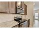 Elegant kitchen details include granite countertops, subway tile backsplash, and stainless appliances at 94 Depot Landing Rd, Auburn, GA 30011