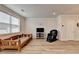 Well-lit living room boasts wood-look floors, ample space, and modern recessed lighting at 94 Depot Landing Rd, Auburn, GA 30011