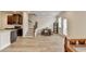 An open-concept kitchen, dining, and living room is displayed with hardwood floors and large windows at 94 Depot Landing Rd, Auburn, GA 30011