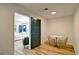 A dining room features a modern table with seating next to an exterior entrance at 101 Stroud Se Dr, Mableton, GA 30126