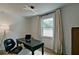 A home office with a window, desk, modern lighting and neutral colors at 101 Stroud Se Dr, Mableton, GA 30126