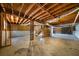 Exposed basement with concrete floor, wooden beams, and visible utilities at 120 Paces Lakes Pt, Dallas, GA 30157