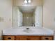Bathroom vanity featuring a large mirror and a sink set in a white countertop at 120 Paces Lakes Pt, Dallas, GA 30157