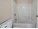 Clean bathtub and shower combination with white tile and neutral wall color at 120 Paces Lakes Pt, Dallas, GA 30157