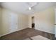 Neutral bedroom features carpet, white ceiling fan and a bathroom doorway at 120 Paces Lakes Pt, Dallas, GA 30157
