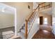 Bright, carpeted staircase leading to the second story with hardwood flooring at 120 Paces Lakes Pt, Dallas, GA 30157