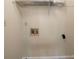 Bright laundry room featuring water hookups and a wire shelf for storage at 120 Paces Lakes Pt, Dallas, GA 30157