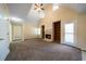 Open living area with a vaulted ceiling, fireplace, built-in shelving, and access to the backyard at 120 Paces Lakes Pt, Dallas, GA 30157
