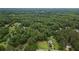 Lush aerial view of the property with mature trees and surrounding neighborhood at 1267 Austin Bridge Rd, Douglasville, GA 30134