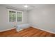 Simple bedroom featuring hardwood flooring and natural light at 1267 Austin Bridge Rd, Douglasville, GA 30134
