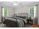 Neutral bedroom featuring large windows and wood flooring at 1267 Austin Bridge Rd, Douglasville, GA 30134