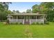 Charming single-story home featuring a welcoming front porch and a well-maintained lawn at 1267 Austin Bridge Rd, Douglasville, GA 30134