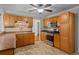 Traditional kitchen with stainless steel appliances and wooden cabinets at 1267 Austin Bridge Rd, Douglasville, GA 30134