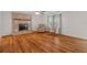 Inviting living room features a brick fireplace and beautiful hardwood floors at 1267 Austin Bridge Rd, Douglasville, GA 30134