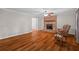 Comfortable living room with hardwood floors, brick fireplace, and ample natural light at 1267 Austin Bridge Rd, Douglasville, GA 30134