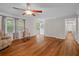 Bright living room with large windows, hardwood floors, and neutral color scheme at 1267 Austin Bridge Rd, Douglasville, GA 30134