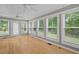 Light-filled sunroom with multiple windows offering serene outdoor views at 1267 Austin Bridge Rd, Douglasville, GA 30134