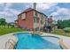 Stunning backyard with an inground pool, lush grass, and mature landscaping at 1283 Silver Trace Sw Dr, Lilburn, GA 30047