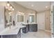 Bright bathroom features a double vanity, makeup counter and decorative lighting at 1283 Silver Trace Sw Dr, Lilburn, GA 30047