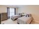 Comfortable bedroom featuring two twin beds and neutral decor at 1283 Silver Trace Sw Dr, Lilburn, GA 30047
