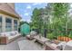 Relax on the deck with stylish outdoor furniture overlooking a lush backyard at 1283 Silver Trace Sw Dr, Lilburn, GA 30047