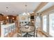 Bright breakfast nook with wood floors, a round table, and views to the living room area at 1283 Silver Trace Sw Dr, Lilburn, GA 30047