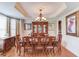 Formal dining room with chandelier, hardwood floors, and elegant furnishings at 1283 Silver Trace Sw Dr, Lilburn, GA 30047