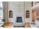 Elegant fireplace with built-in shelves, beautiful space with modern decor at 1283 Silver Trace Sw Dr, Lilburn, GA 30047