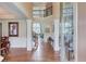 Elegant foyer with hardwood floors, staircase, and decorative columns at 1283 Silver Trace Sw Dr, Lilburn, GA 30047