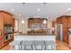 Gourmet kitchen with granite countertops, stainless steel appliances, and a large island at 1283 Silver Trace Sw Dr, Lilburn, GA 30047