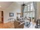 Bright living room with soaring ceilings and large windows, lots of natural light at 1283 Silver Trace Sw Dr, Lilburn, GA 30047