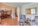 Open-concept living room with fireplace, hardwood floors, and elegant decor at 1283 Silver Trace Sw Dr, Lilburn, GA 30047