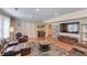 Large living room featuring leather furniture, laminate flooring, and wet bar at 1283 Silver Trace Sw Dr, Lilburn, GA 30047