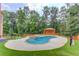 Sparkling pool and spa with lush landscaping for ultimate relaxation at 1283 Silver Trace Sw Dr, Lilburn, GA 30047