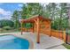 Enjoy the covered poolside cabana next to the inground pool at 1283 Silver Trace Sw Dr, Lilburn, GA 30047
