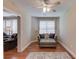 Relaxing sitting area with upholstered chair, ottoman and lots of natural light at 1283 Silver Trace Sw Dr, Lilburn, GA 30047