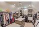 Spacious walk-in closet with custom shelving and center island at 1283 Silver Trace Sw Dr, Lilburn, GA 30047