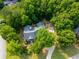 Beautiful aerial view of a home with a sprawling yard surrounded by lush green trees at 19 Thimblemill Ct, Villa Rica, GA 30180