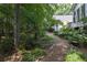 Landscaped backyard with stone path at 19 Thimblemill Ct, Villa Rica, GA 30180