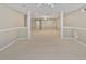 Large basement with neutral colored carpet and white trim, featuring recessed lighting and support columns at 19 Thimblemill Ct, Villa Rica, GA 30180