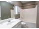 Bathroom featuring a tub and shower combination with a white vanity and a large mirror at 19 Thimblemill Ct, Villa Rica, GA 30180