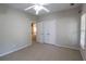 Inviting bedroom with double closet doors, neutral carpeting, and a ceiling fan at 19 Thimblemill Ct, Villa Rica, GA 30180