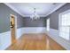 Bright dining room with hardwood floors and a chandelier fixture at 19 Thimblemill Ct, Villa Rica, GA 30180