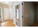 Hallway showing hardwood floors and white paneled doors at 19 Thimblemill Ct, Villa Rica, GA 30180